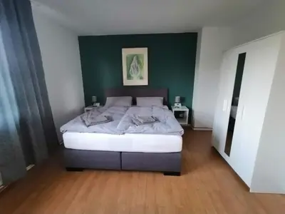 Ein Bett oder Betten in einem Zimmer der Unterkunft Ferienwohnung achtpunkt2