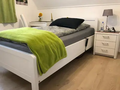 Ein Bett oder Betten in einem Zimmer der Unterkunft Messezimmer 4u