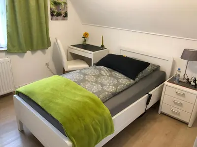 Ein Bett oder Betten in einem Zimmer der Unterkunft Messezimmer 4u