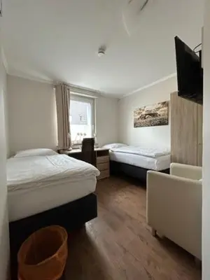 Ein Bett oder Betten in einem Zimmer der Unterkunft Motel de Winter - Motel - Apartmenthaus - Monteurzimmer