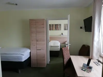 Ein Bett oder Betten in einem Zimmer der Unterkunft Motel de Winter - Motel - Apartmenthaus - Monteurzimmer