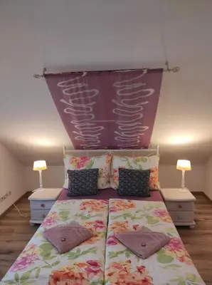 Ein Bett oder Betten in einem Zimmer der Unterkunft Alex