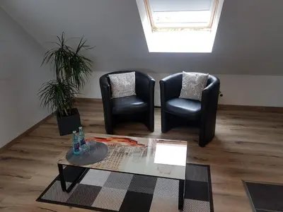 Ein Sitzbereich in der Unterkunft Alex
