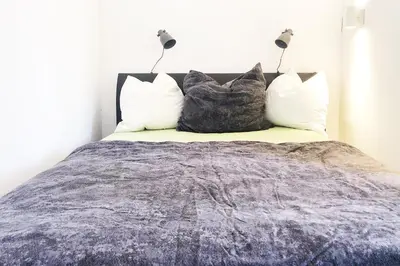 Ein Bett oder Betten in einem Zimmer der Unterkunft Gemütliches Apartment mit Balkon und Tiefgaragenstellplatz