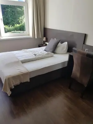 Ein Bett oder Betten in einem Zimmer der Unterkunft Weltmann`s Hotel & Restaurant