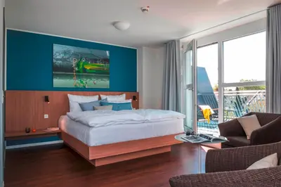 Ein Bett oder Betten in einem Zimmer der Unterkunft Mintrops Concierge Hotel