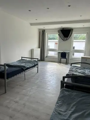 Ein Bett oder Betten in einem Zimmer der Unterkunft Expresszimmervermietung