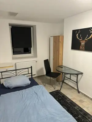 Ein Bett oder Betten in einem Zimmer der Unterkunft Expresszimmervermietung