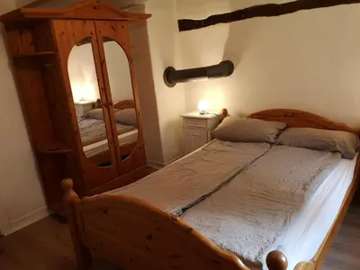 Ein Bett oder Betten in einem Zimmer der Unterkunft Ferienwohnung Hamm Rhynern im alten Bauernhaus 1870