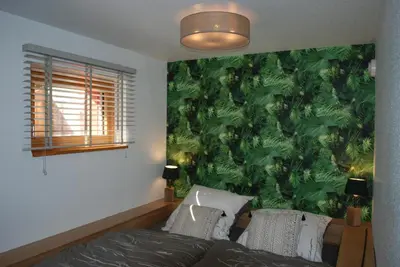 Ein Bett oder Betten in einem Zimmer der Unterkunft Ferienwohnung im Architektenhaus