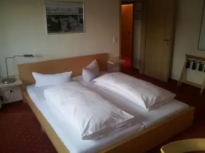 Ein Bett oder Betten in einem Zimmer der Unterkunft T&T by Thiesmann