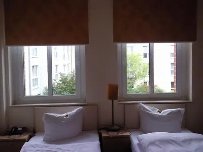 Ein Bett oder Betten in einem Zimmer der Unterkunft T&T by Thiesmann