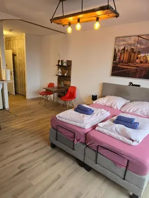 Ein Bett oder Betten in einem Zimmer der Unterkunft Cityapartments MH
