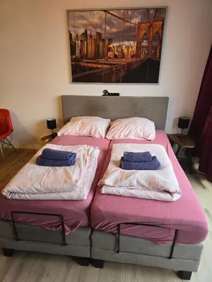 Ein Bett oder Betten in einem Zimmer der Unterkunft Cityapartments MH