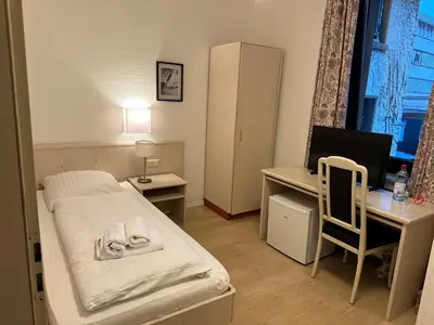 Ein Bett oder Betten in einem Zimmer der Unterkunft Hotel 