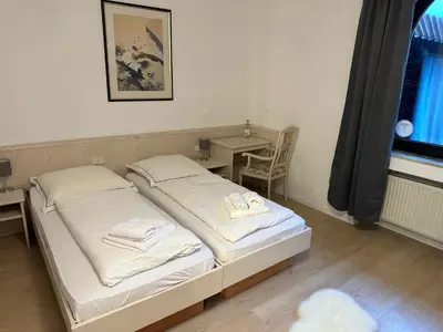 Ein Bett oder Betten in einem Zimmer der Unterkunft Hotel 