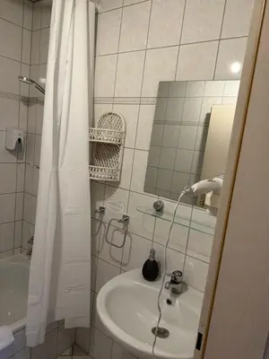 Ein Badezimmer in der Unterkunft Hotel 