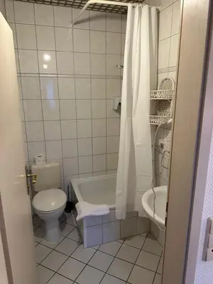 Ein Badezimmer in der Unterkunft Hotel 