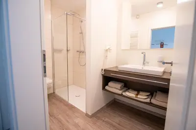 Ein Badezimmer in der Unterkunft Hotel am Tiergarten