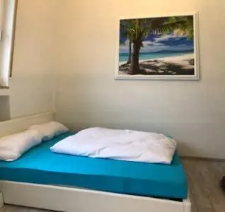 Ein Bett oder Betten in einem Zimmer der Unterkunft Gemütliches Appartement im EG mit eigenem Zugang in guter Wohnlage