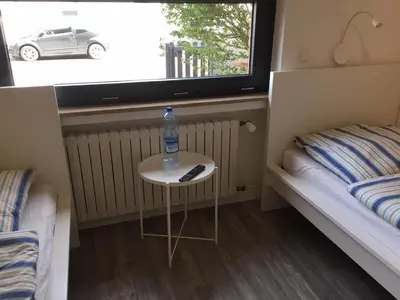 Ein Bett oder Betten in einem Zimmer der Unterkunft Zimmer nahe Messe und Flughafen