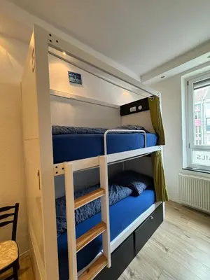 Ein Bett oder Betten in einem Zimmer der Unterkunft Hostel WohnZimmer-Essen