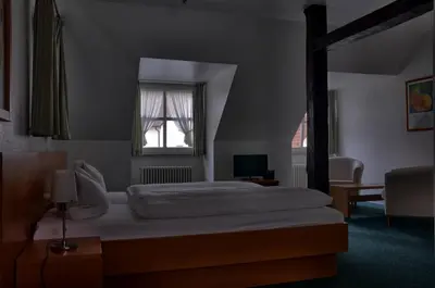 Ein Bett oder Betten in einem Zimmer der Unterkunft Hotel Alte Linden