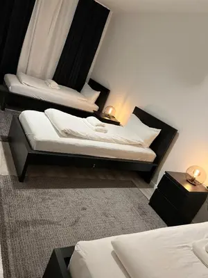 Ein Bett oder Betten in einem Zimmer der Unterkunft E & N Apartments