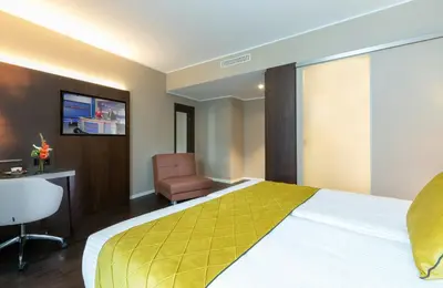 Ein Bett oder Betten in einem Zimmer der Unterkunft Leonardo Hotel Dortmund