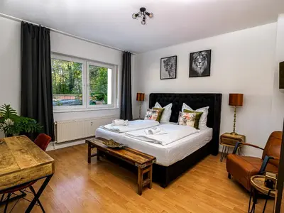 Ein Bett oder Betten in einem Zimmer der Unterkunft JUNIK Apartments 