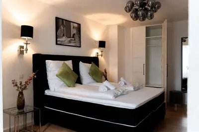 Ein Bett oder Betten in einem Zimmer der Unterkunft JUNIK Apartments 