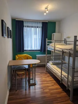 Ein Bett oder Betten in einem Zimmer der Unterkunft Ruhrtropolis Hostel