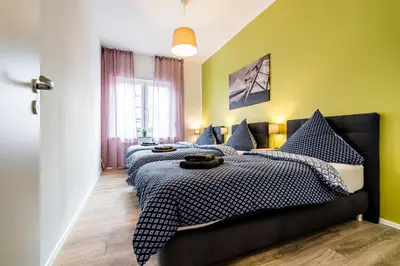 Ein Bett oder Betten in einem Zimmer der Unterkunft Comodo Apartments Solingen