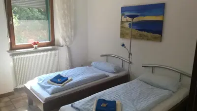 Ein Bett oder Betten in einem Zimmer der Unterkunft Pension Hoffmann