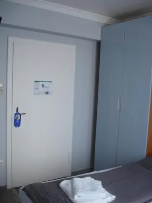 Ein Bett oder Betten in einem Zimmer der Unterkunft City-Pension-Dortmund