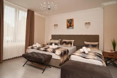 Ein Bett oder Betten in einem Zimmer der Unterkunft Kispet Deluxe Hotels&Suites