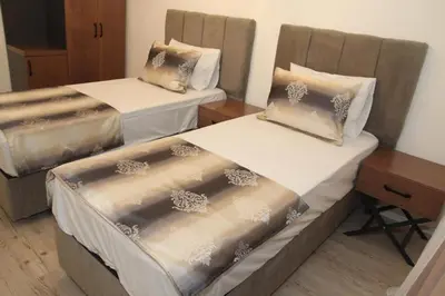 Ein Bett oder Betten in einem Zimmer der Unterkunft Kispet Deluxe Hotels&Suites