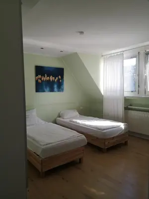 Ein Bett oder Betten in einem Zimmer der Unterkunft Aparthotel Messe Flughafen