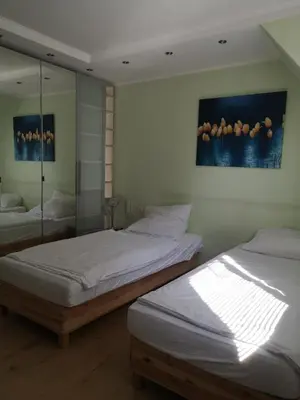 Ein Bett oder Betten in einem Zimmer der Unterkunft Aparthotel Messe Flughafen
