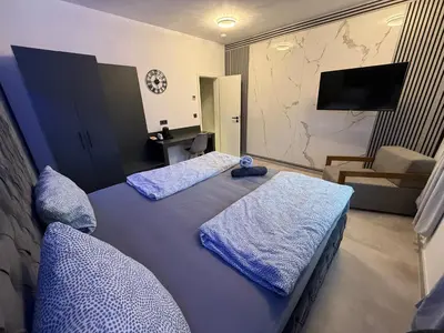 Ein Bett oder Betten in einem Zimmer der Unterkunft All In