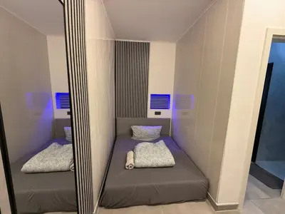 Ein Bett oder Betten in einem Zimmer der Unterkunft All In