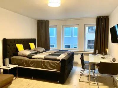 Ein Bett oder Betten in einem Zimmer der Unterkunft City Center Apartments Düsseldorf