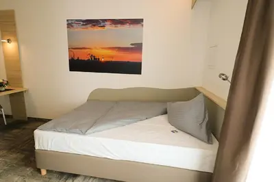 Ein Bett oder Betten in einem Zimmer der Unterkunft Petul Apart Hotel An'ne 40