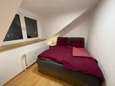 Ein Bett oder Betten in einem Zimmer der Unterkunft Paradise Apartments