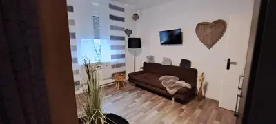 Ein Sitzbereich in der Unterkunft Ferienwohnung Talblume