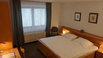 Ein Bett oder Betten in einem Zimmer der Unterkunft Apparthaus Arosa