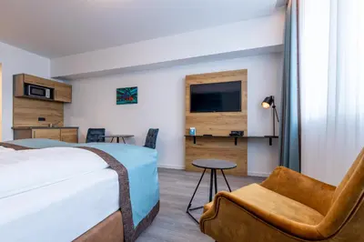 Ein Bett oder Betten in einem Zimmer der Unterkunft Trip Inn Hotel & Suites Essen