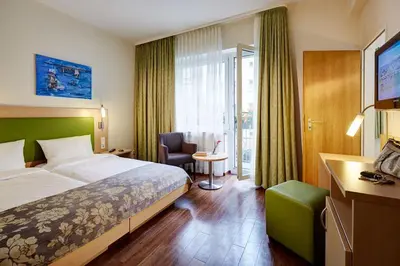 Ein Bett oder Betten in einem Zimmer der Unterkunft Hotel Imperial Düsseldorf Superior - Sure Collection by Best Western