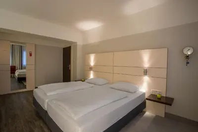 Ein Bett oder Betten in einem Zimmer der Unterkunft Ferrotel Duisburg - Partner of SORAT Hotels