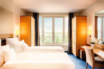 Ein Bett oder Betten in einem Zimmer der Unterkunft Welcome Hotel Wesel